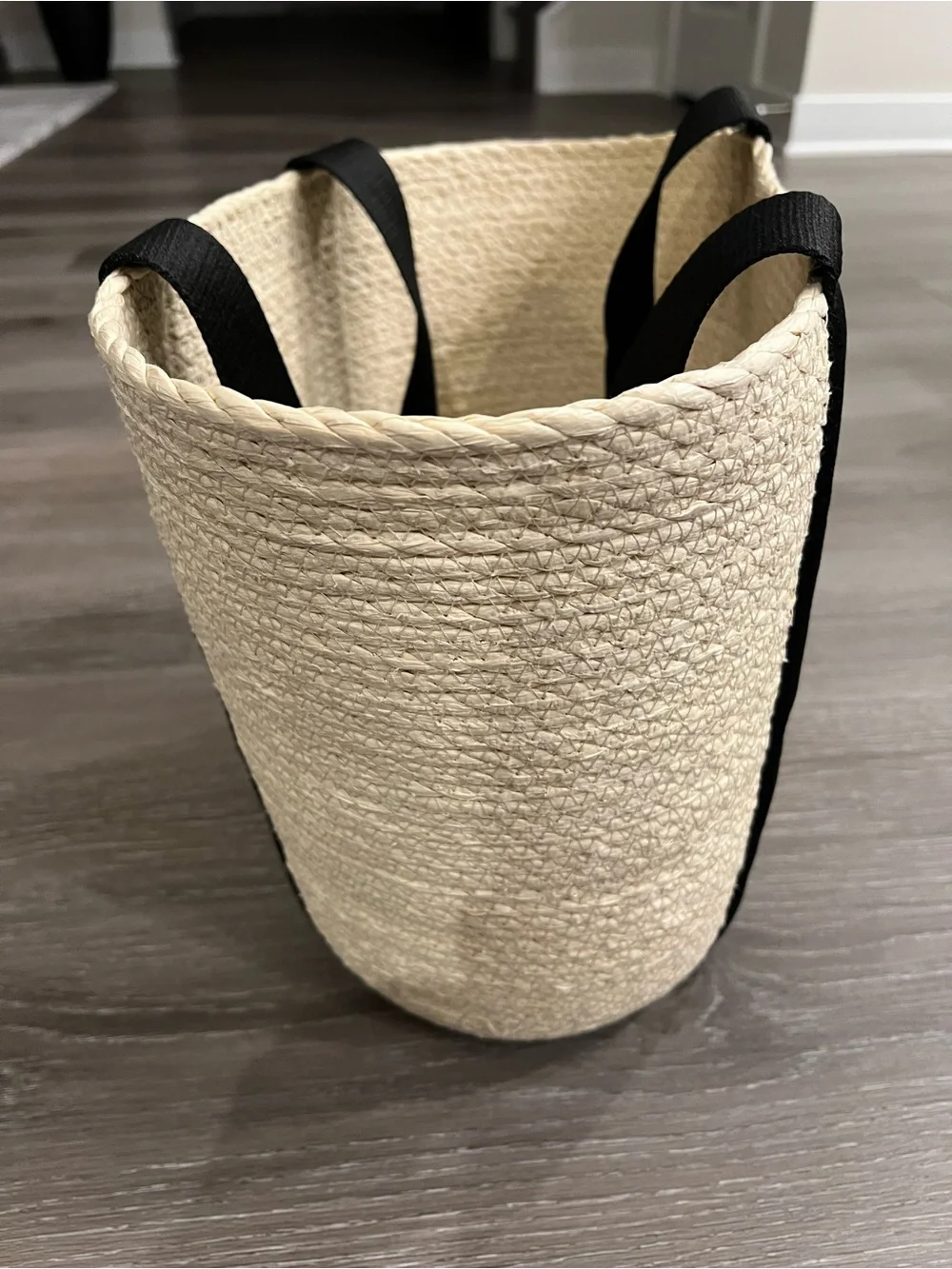 Straw Rope Woven Market Basket Tote w/ Black Handles. 12” tall x 15.5” wide.